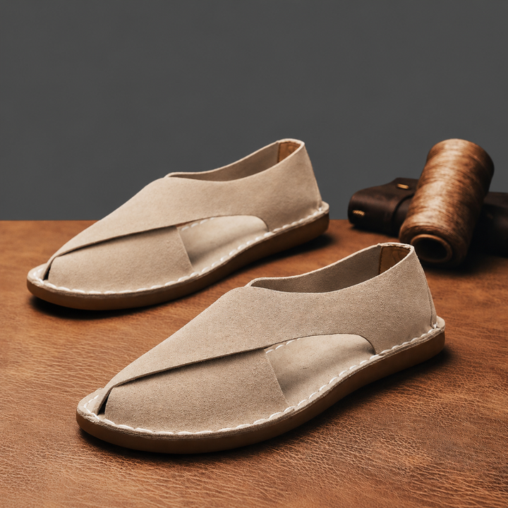 Stylish men's slip-on sandals with cross-wrap design, perfect for beach & everyday comfort.