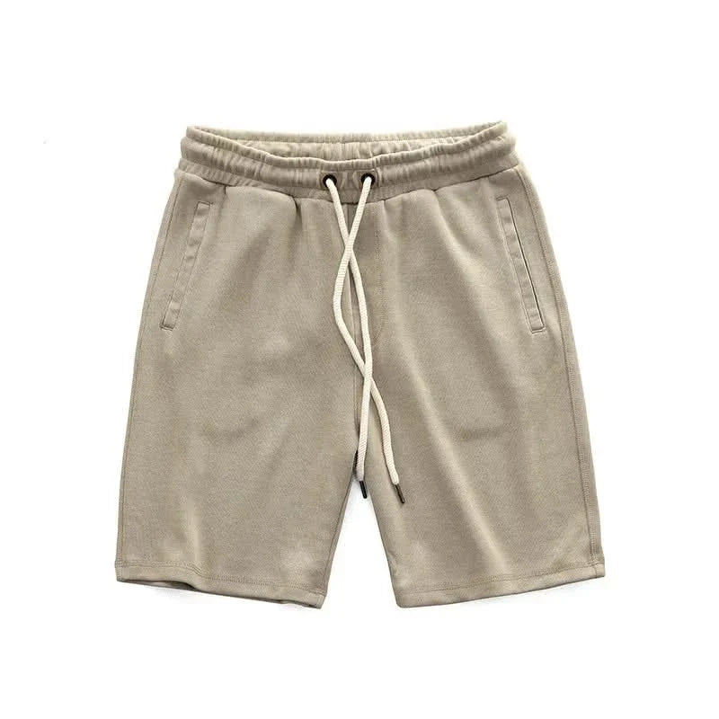 Men's comfortable performance shorts with drawstring & pockets, ideal for gym workouts & casual summer wear.