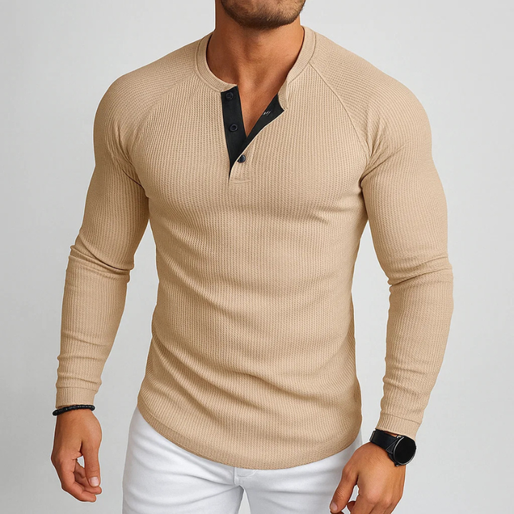 Close-up of a men's everyday textured Henley long sleeve shirt, highlighting its unique fabric & comfortable feel.