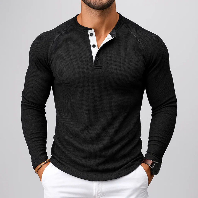 Man modeling a tailored fit men's textured Henley long sleeve shirt, showcasing casual everyday fall fashion.