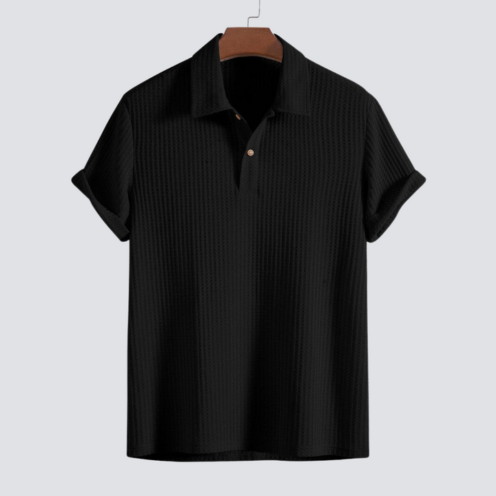 Close-up of the textured men's waffle knit polo shirt fabric, highlighting its softness for casual wear.