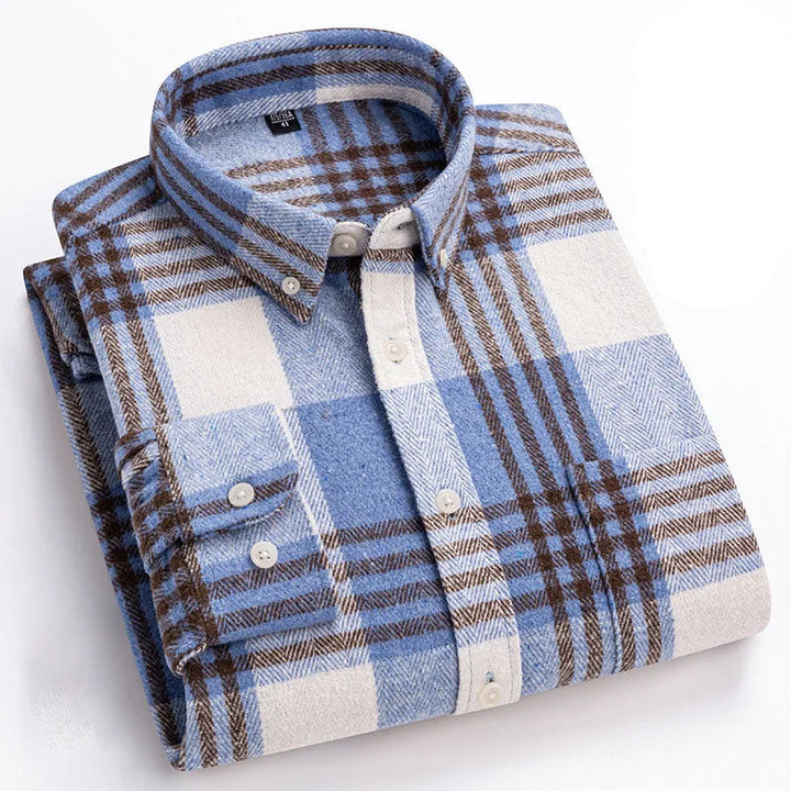 Detail of button down collar and buttons on a men's cozy brushed flannel shirt, stylish and warm.