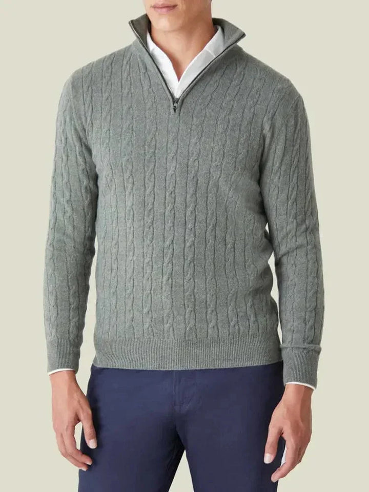 Man wearing a fashionable cable knit half-zip jumper, showcasing its comfy, smart casual men's style.