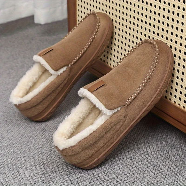 Plush men's slip-on house shoes, providing cozy warmth and comfort.
