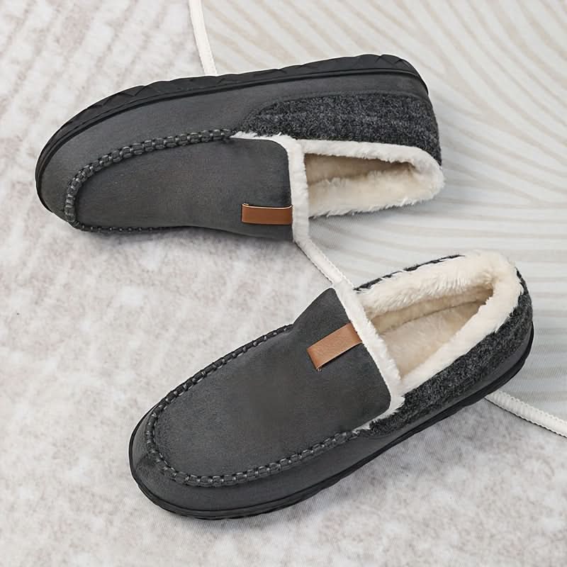 Soft men's slip-on slippers for home comfort, perfect for chilly evenings.