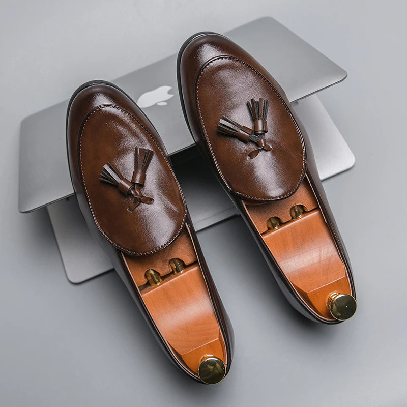 Classic men's tassel loafers with crescent toe design, refined slip-on dress shoes for modern man.