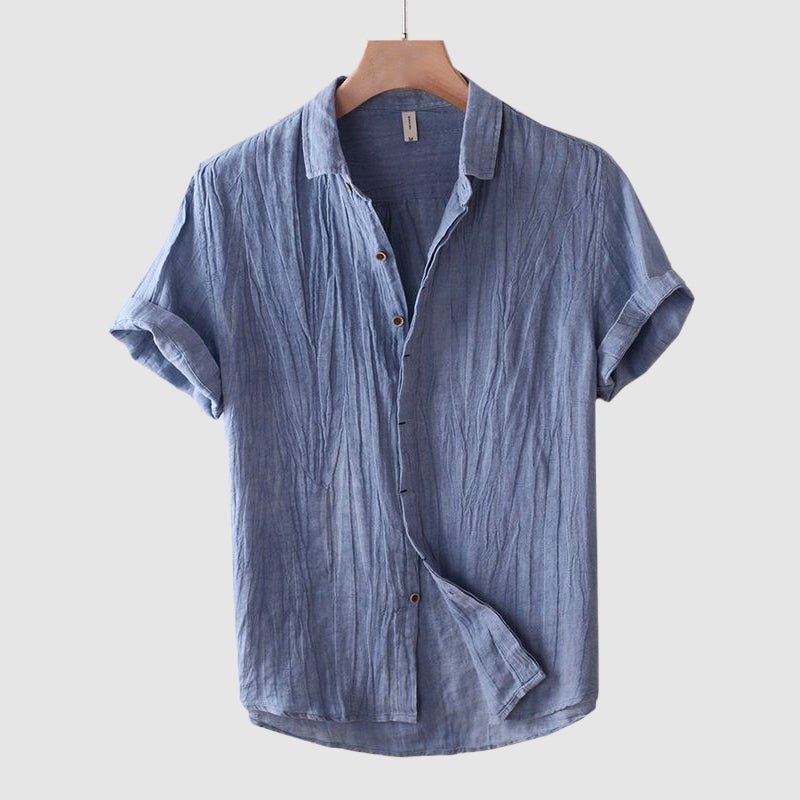 Close-up of a men's stylish crinkle texture short sleeve shirt, showcasing unique fabric for relaxed comfort.
