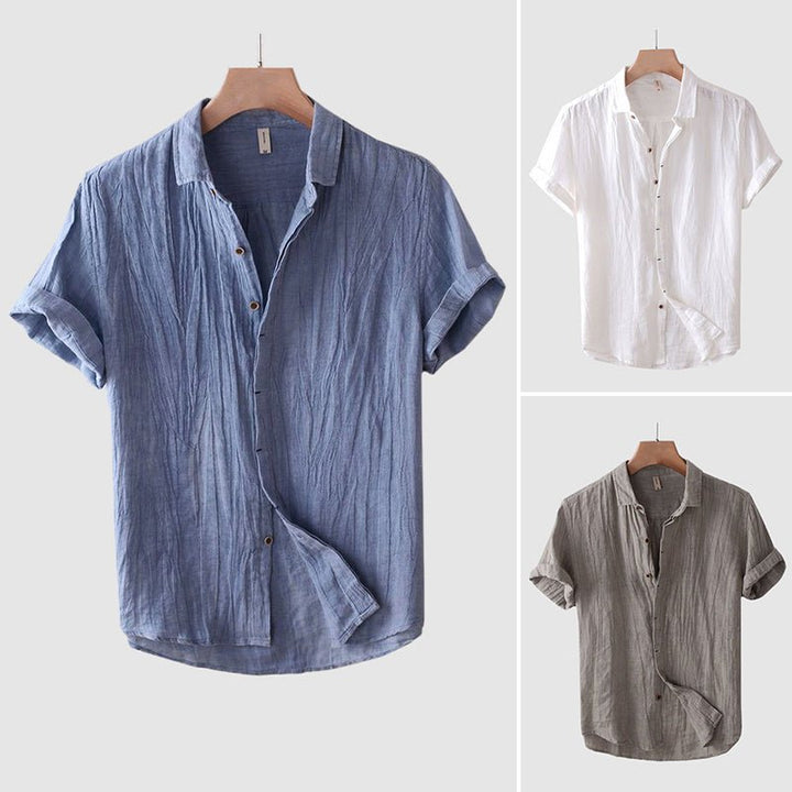 Fashionable men's button-up short sleeve crinkle shirt, offering a relaxed and stylish look for any casual occasion.
