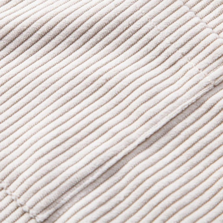 Close-up of a men's short-sleeve Cuban collar shirt, highlighting the soft texture of the corduroy fabric.