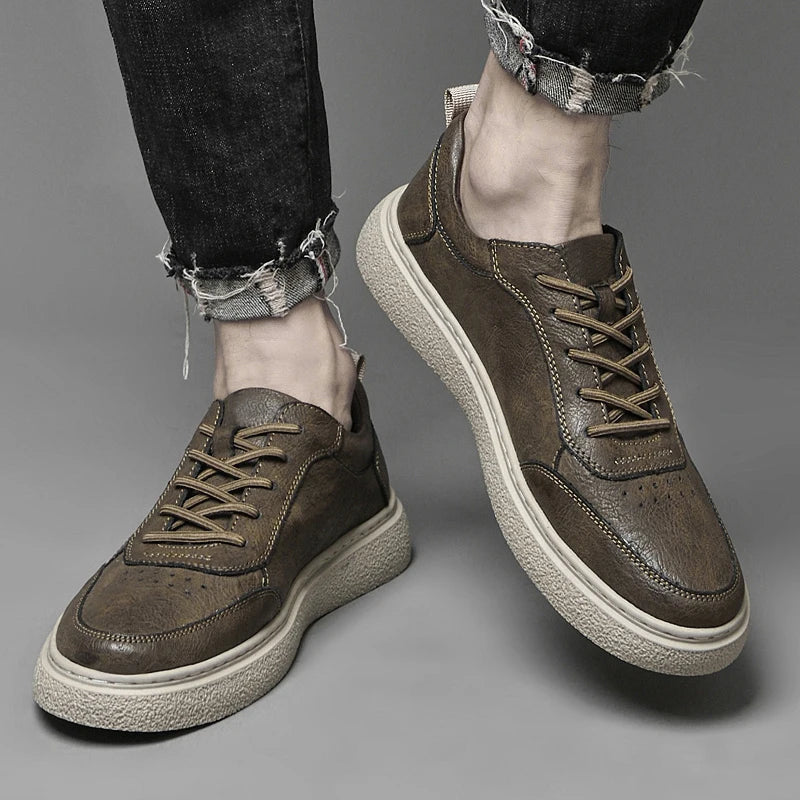Stylish men's leather casual sneakers in a minimalist design. Enjoy everyday comfort with these quality shoes.