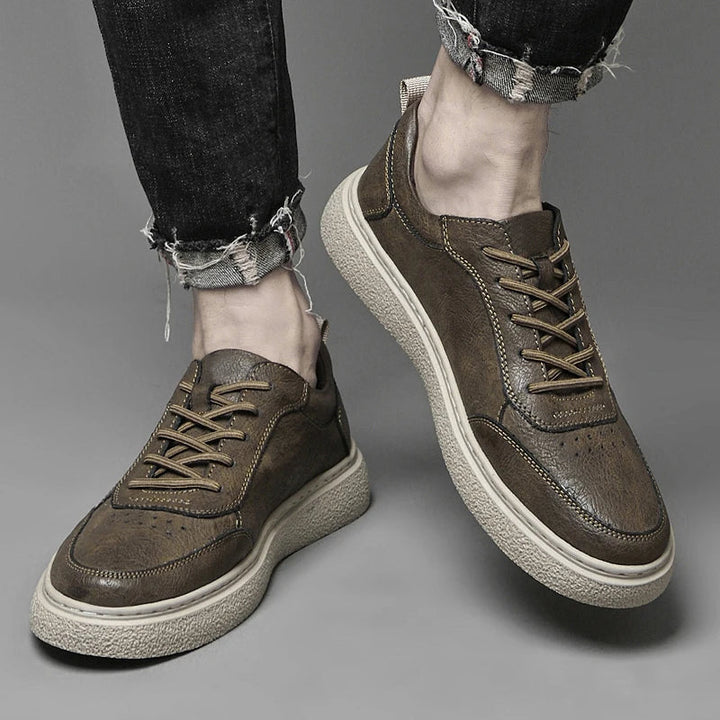 Stylish men's leather casual sneakers in a minimalist design. Enjoy everyday comfort with these quality shoes.