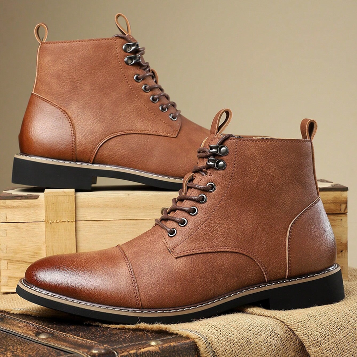 Side view of men's all-terrain boots, emphasizing ankle support, rugged sole design, and durable build.