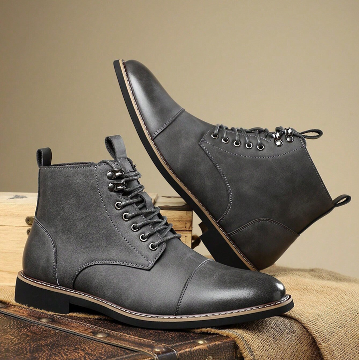 Men's all-terrain boots with rugged sole & superior traction grip for secure footing on any surface.