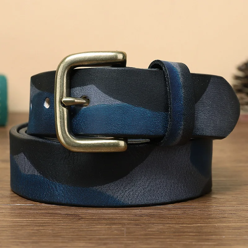 Durable camo men's belt, full-grain leather construction & heavy-duty brass buckle. Essential accessory.