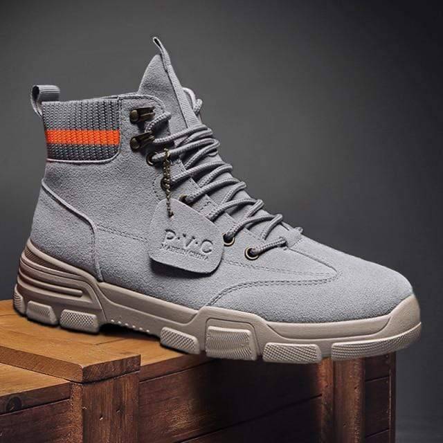 Pair of men's tactical hiking boots, durable suede, perfect for rugged terrain.