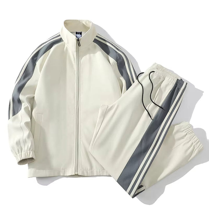 Vibrant men's color-block active tracksuit set. Versatile zip-up jacket & joggers for gym, sports, or casual comfort.