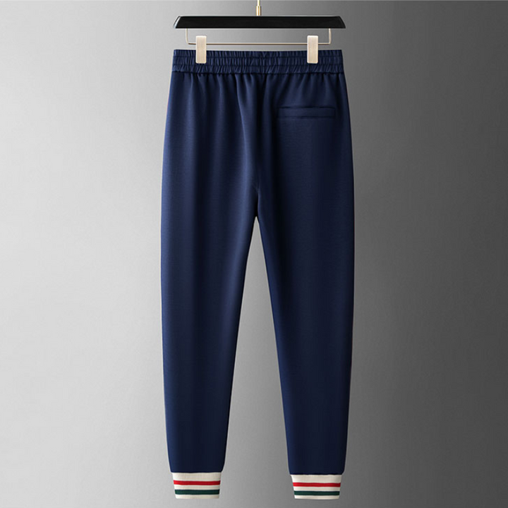 Men's casual outfit: Royal Navy full-zip tracksuit with legacy cream stripes. A comfortable two-piece set.