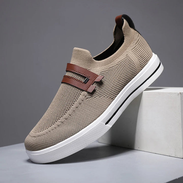 Men's Echelon breathable slip-on loafers in dark leather, offering comfort and style for daily wear.