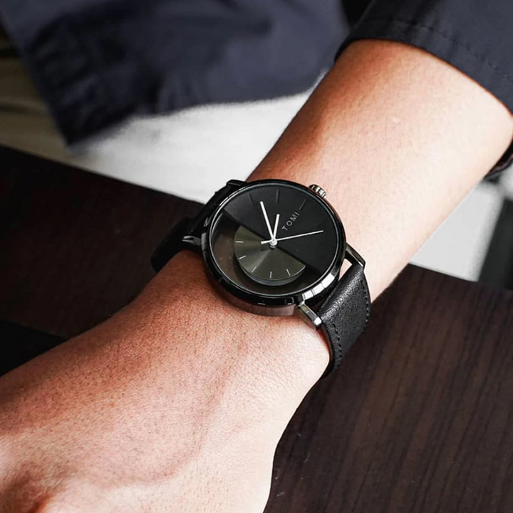 Stylish Eclipse men's timepiece, black leather band, unique half-dial, a true statement piece.