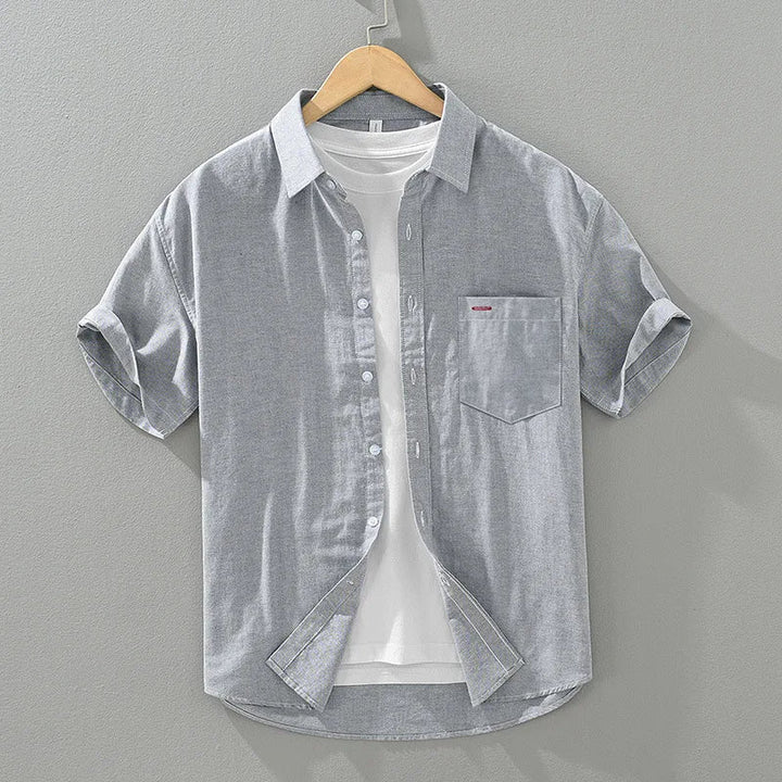 Men's relaxed fit short sleeve shirt, button-up design, perfect lightweight choice for summer wear.