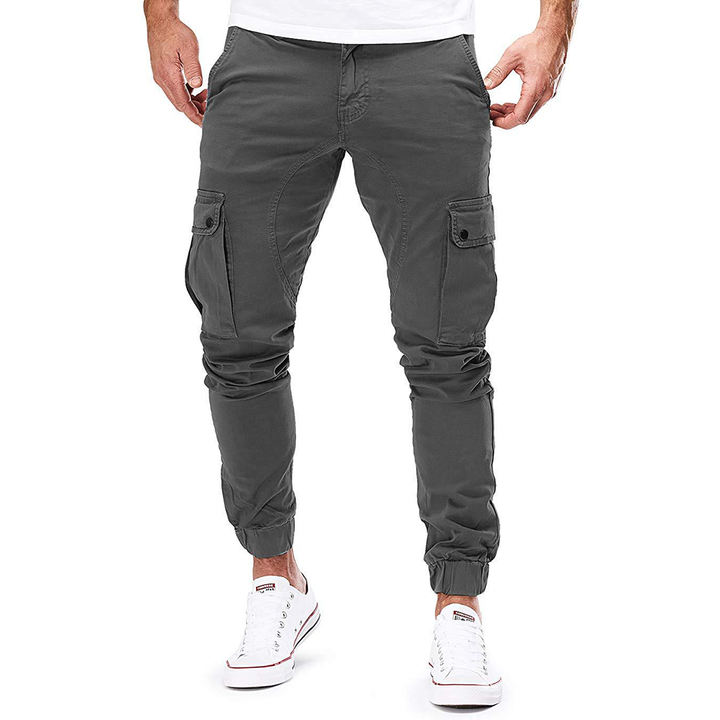 Model wearing Men's Everyday Comfort Cargo Joggers. Athletic fit, comfortable stretch, ideal for men's casual wear.
