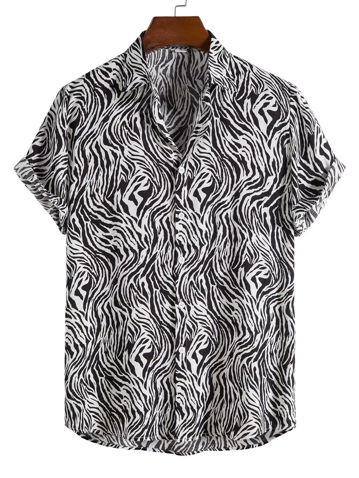 Relaxed fit men's statement shirt with vibrant exotic print & button-down front. Casual men's fashion.