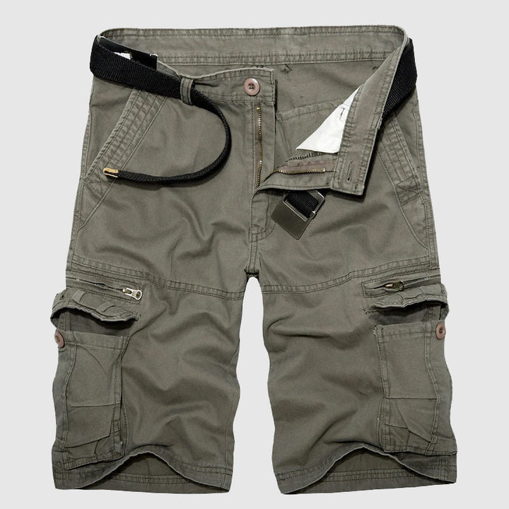 Close-up: Men's utility cargo shorts, highlighting spacious multi-pockets for travel essentials & adventure.