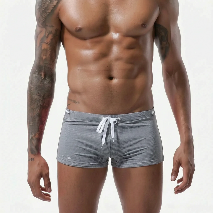 Versatile men's fitted low-rise swim trunks, quick-dry & athletic for swimming, beach or active use.