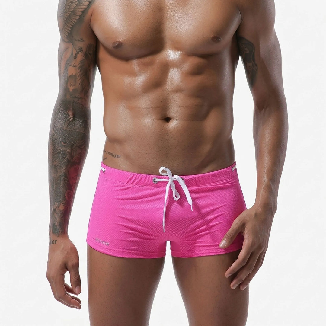 Textured men's fitted low-rise swim trunks, quick-dry & athletic for active swim performance.