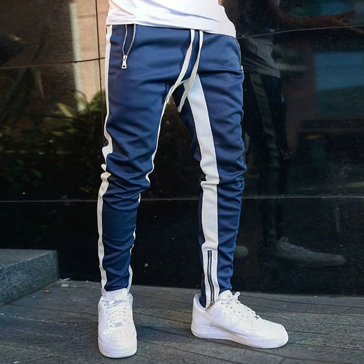 Black men's FlexStride stretch pants with secure zip pockets, perfect for workouts, casual wear & sportswear.