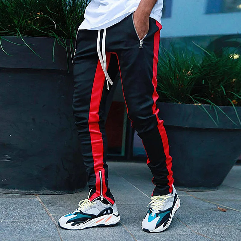 Man wearing FlexStride men's joggers outdoors, showcasing their casual style, flexibility, and secure pockets.
