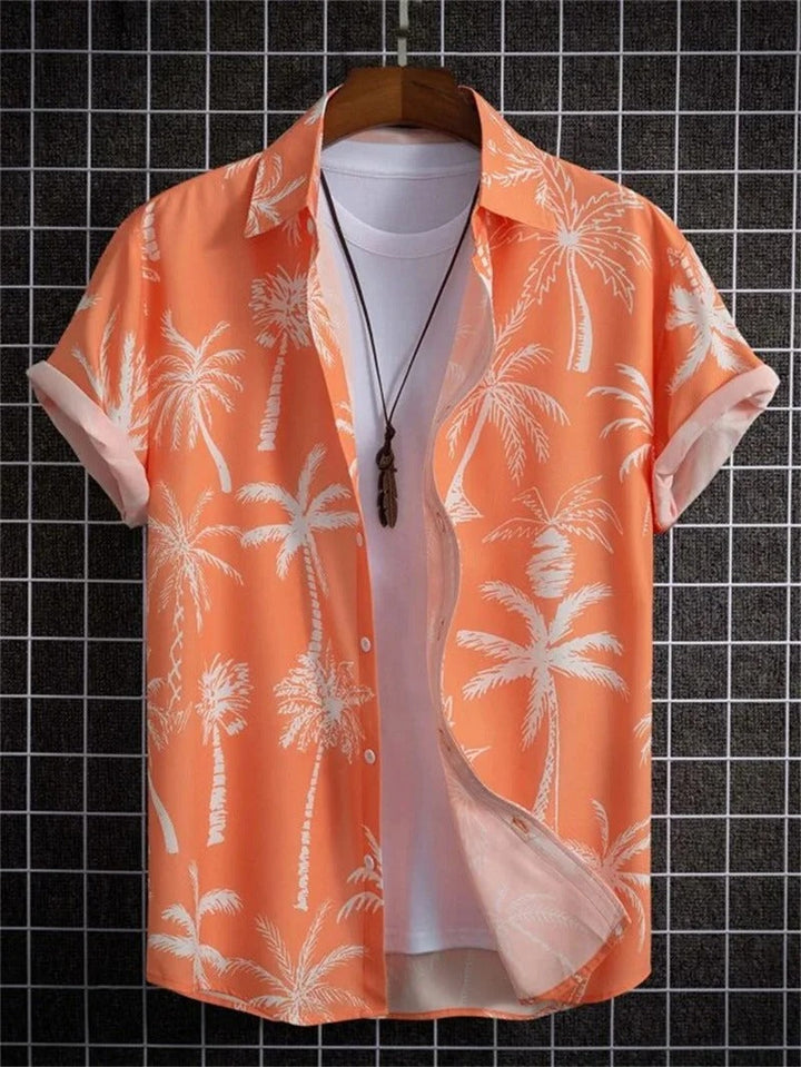 Vibrant men's floral print short-sleeve shirt. Adds a pop of color to summer outfits. Collared & button-up.