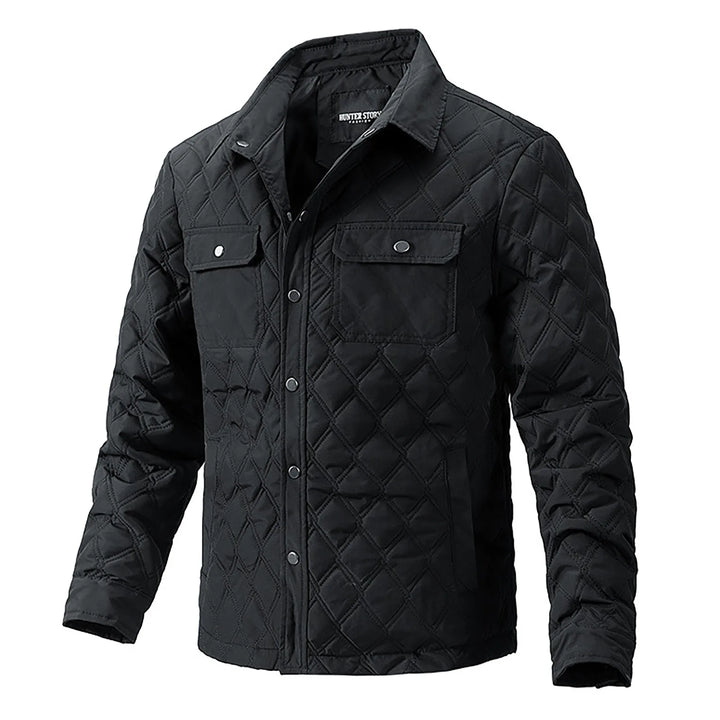 Khaki men's Forge quilted utility jacket with snap closure, chest pockets. Rugged casual outerwear.