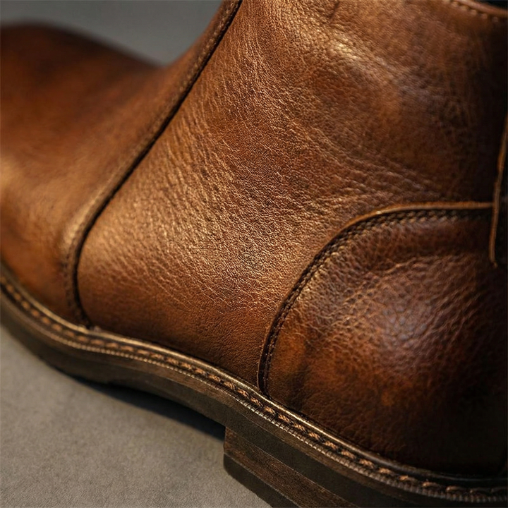 Stylish men's full-grain leather ankle boots with comfortable design. Durable choice for everyday wear.