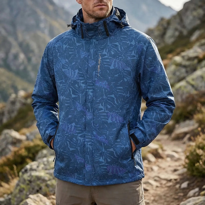 Men's full-zip hooded windbreaker jacket, offering lightweight weather protection for outdoor activities.