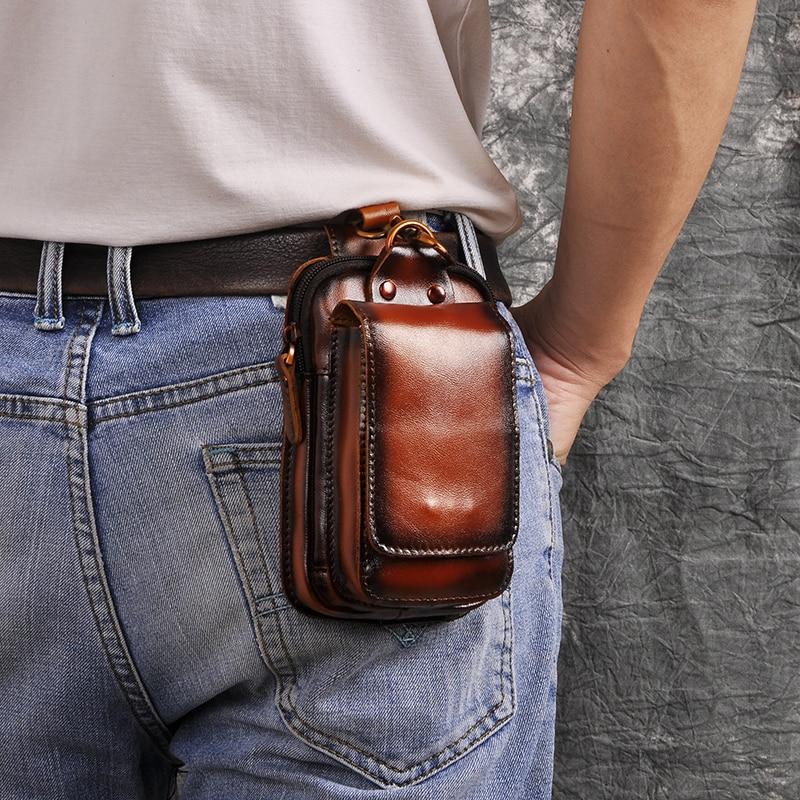 Genuine leather men's waist pack with multiple pockets. Brown, full-grain, & durable travel gear.