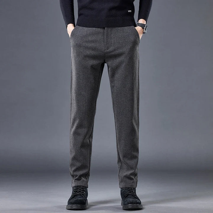 Khaki men's tailored contour fit pants. Comfortable stretch fabric provides modern style for versatile wear.