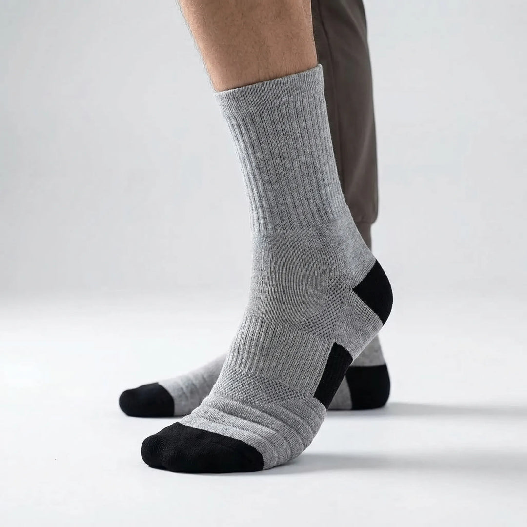 Athletic men's high-tube compression socks (3-pack) for enhanced performance in basketball, cycling & training.