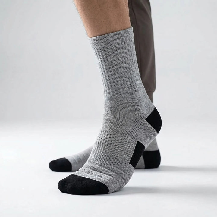 Athletic men's high-tube compression socks (3-pack) for enhanced performance in basketball, cycling & training.