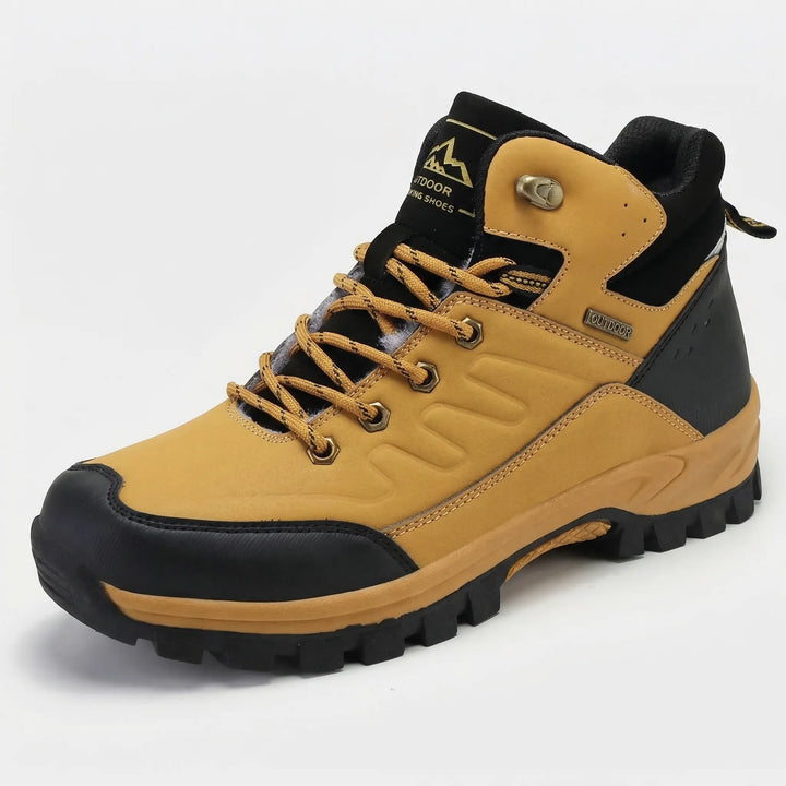 Warm men's high-top insulated winter hiking boots, providing extreme cold protection on snowy trails.