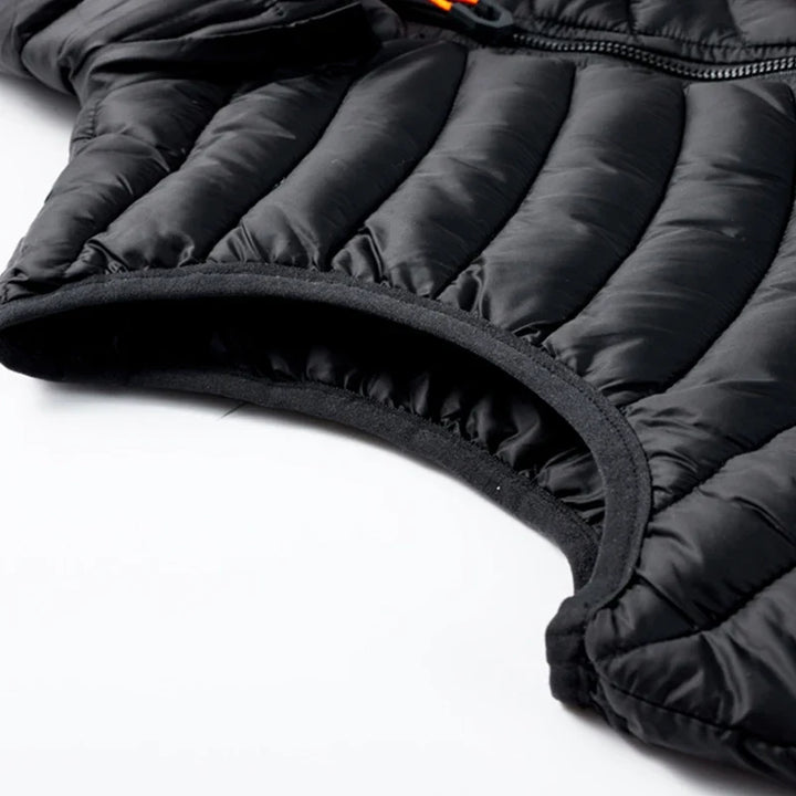 Men's insulated cold weather vest, water-resistant with a detachable hood, perfect for layering and outdoor protection.