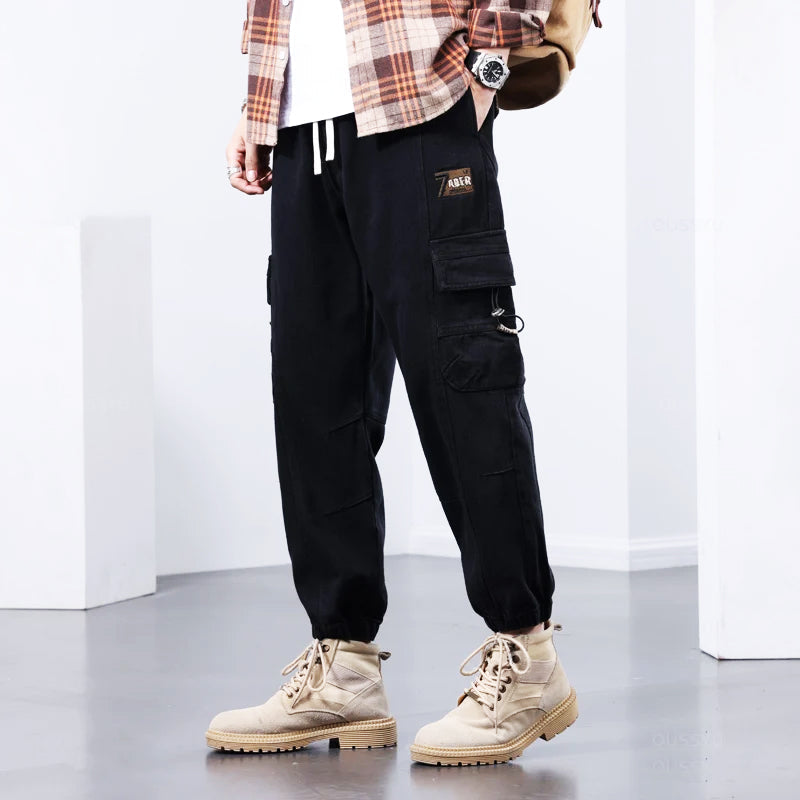 Brown Kellan men's utility cargo pants, perfect for workwear & casual outdoor adventures.