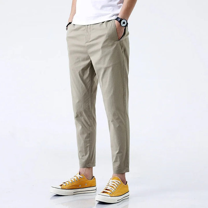 Black men's stretch cotton chinos, straight fit, ankle length casual pants offering maximum comfort.