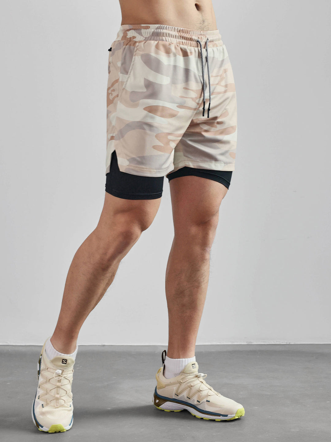Multiple pairs of men's Kinetic mesh workout shorts, essential activewear collection.