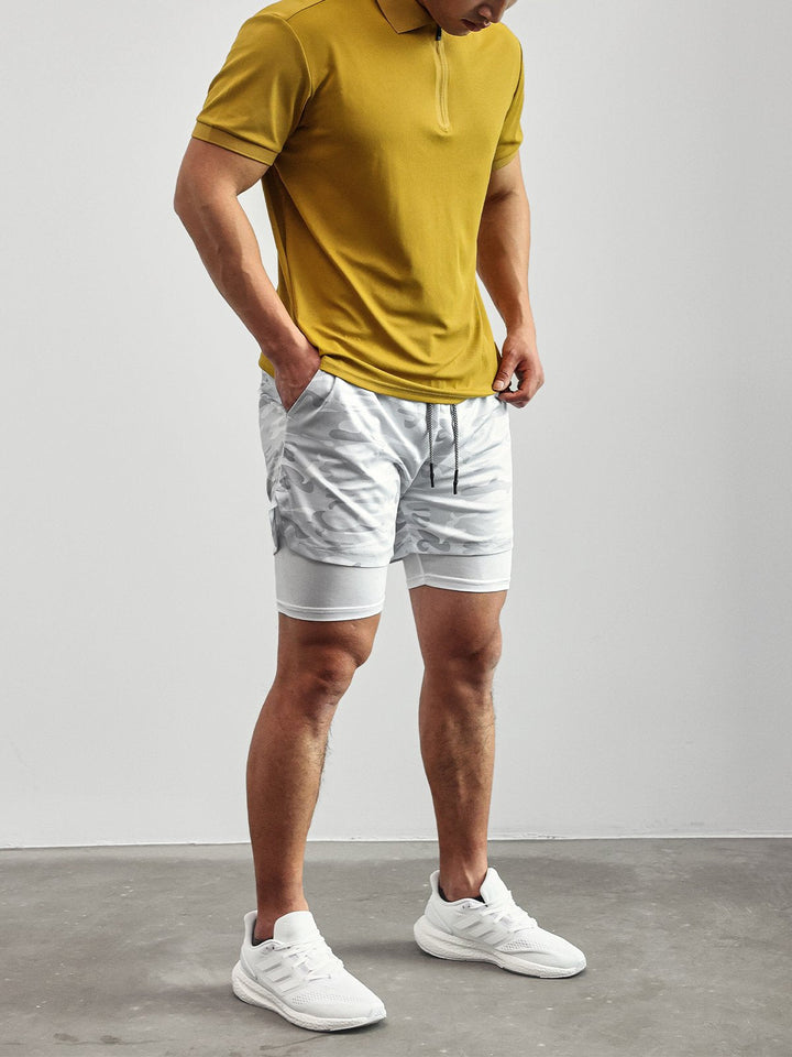 Close-up of men's Kinetic mesh fabric, highlighting texture for gym & performance shorts.