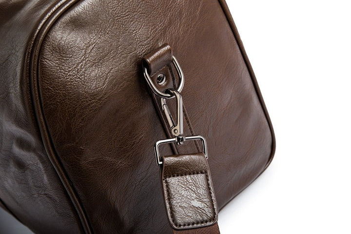 Rugged men's leather travel duffel, durable and lightweight carry-on for any trip.
