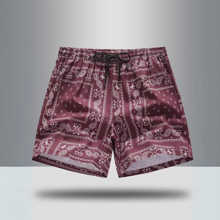 Retro men's athletic shorts featuring a vibrant paisley print for activewear or casual streetwear.