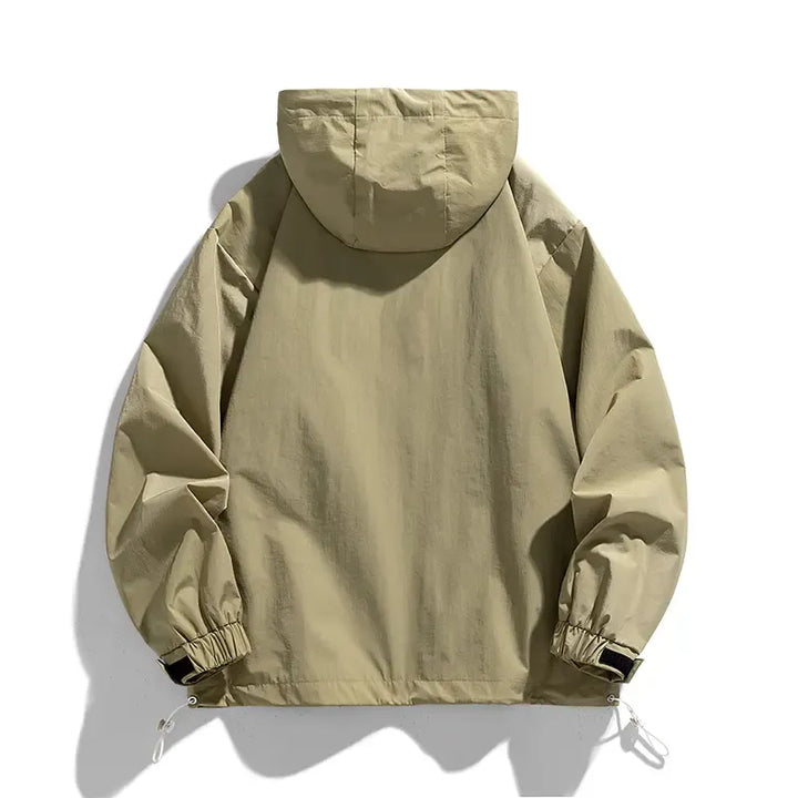 Stylish brown orange men's lightweight windbreaker. Half-zip, adjustable hood for weather protection.