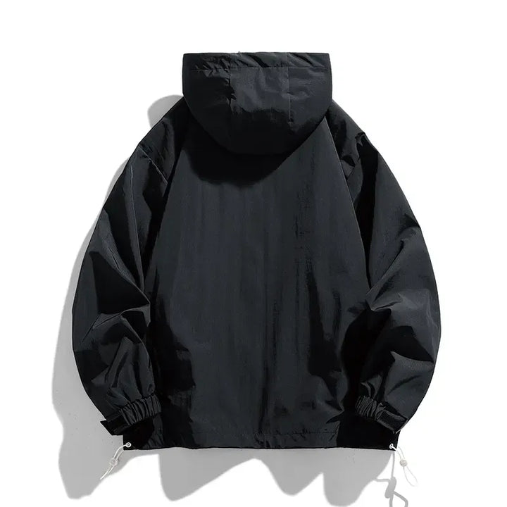 Sleek black men's lightweight windbreaker jacket. Modern fit, ideal casual outerwear for active men.