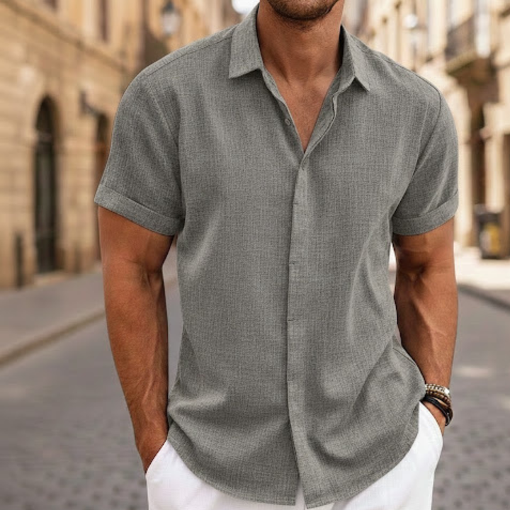 Men's casual summer polo shirt, short sleeve & button front. Lightweight design for adult warm weather fashion.